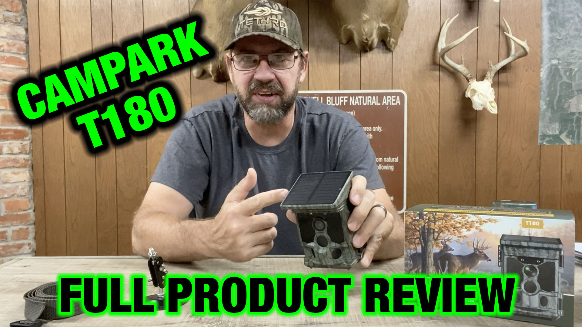 Image of the author holding a Campark T180 trail camera for this product review.
