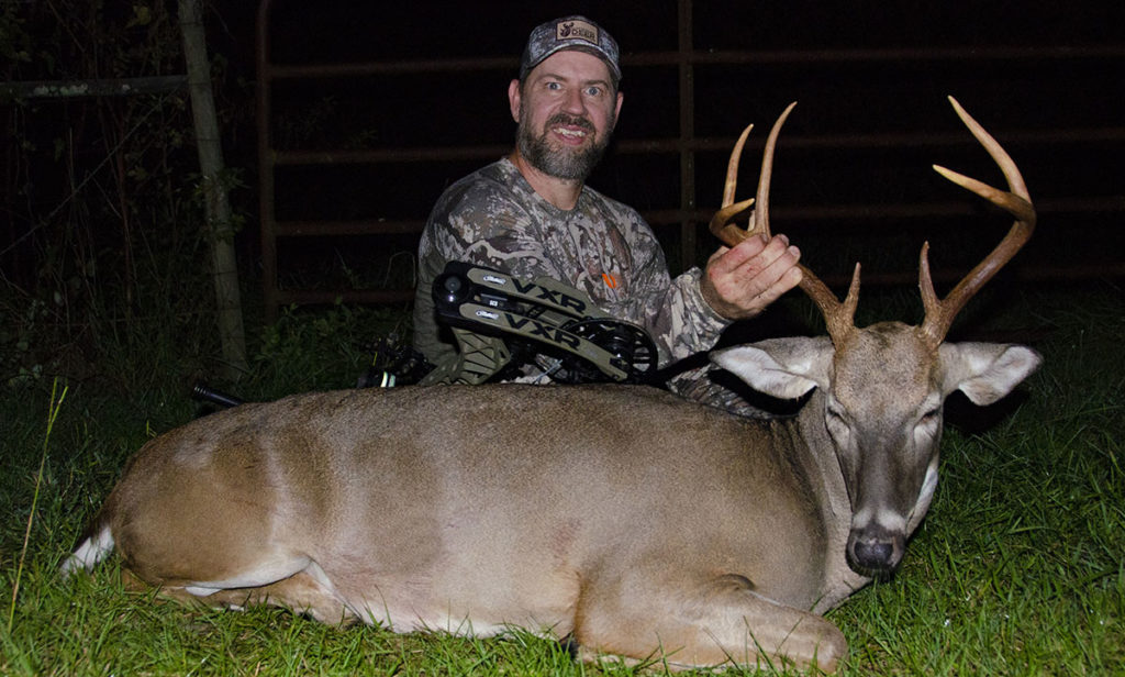 Photo of the author with a buck he harvested with his bow on his own property.