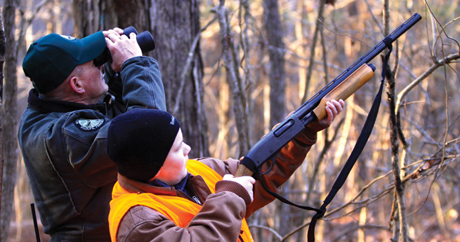 Photo of a Mississippi youth squirrel hunter and his mentor.